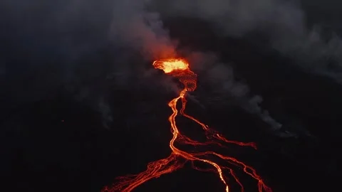 Volcanic Eruption Aerial View Featuring Molten Lava Flowing over Dark Terrain 库存影片 331044520