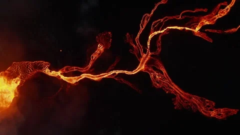 Volcanic Eruption Aerial View Featuring Glowing Molten Lava Flowing in Dark 库存影片 331044780