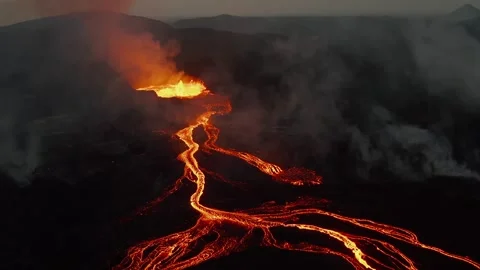 Volcanic Eruption Aerial View Featuring Molten Lava Flows in Dark Landscape Stock Footage 331044883