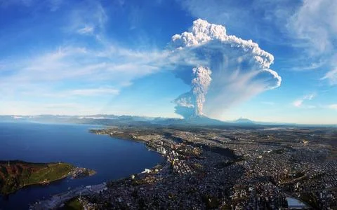 Volcanic Eruption Ash Cloud Over Coastal City Aerial View Stock Photos