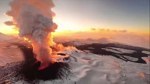 Volcanic eruption with ash cloud at sunrise Stock Footage 337033977