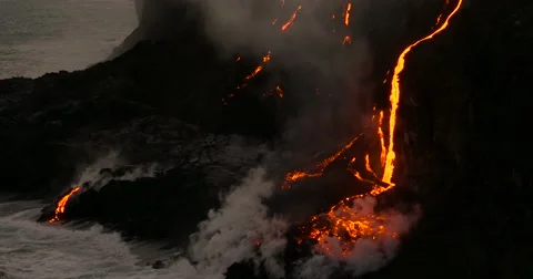 Volcanic Eruption Lava flowing into ocean Hawaii Stock Footage 66516186