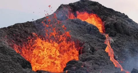 Volcanic eruption red hot lava closeup eruption volcano mountain Stock Footage 336580044
