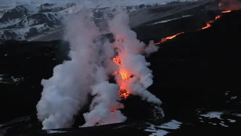 Volcanic eruption spewing lava and smoke in Iceland Stock Footage 330264641