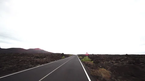 Volcanic island with cloudy sky Stock Footage 318799341