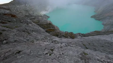 Volcanic lake in the mouth of the volcano Stock Footage 258708564