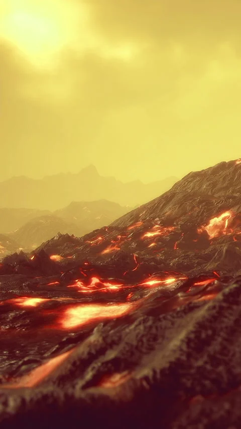 Volcanic landscape with flowing lava under a yellow sky during daylight hours Stock Footage 334183410