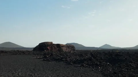 Volcanic landscape with lava fields and rock formation, Caldera de Los Cuervos Stock Footage 346376907