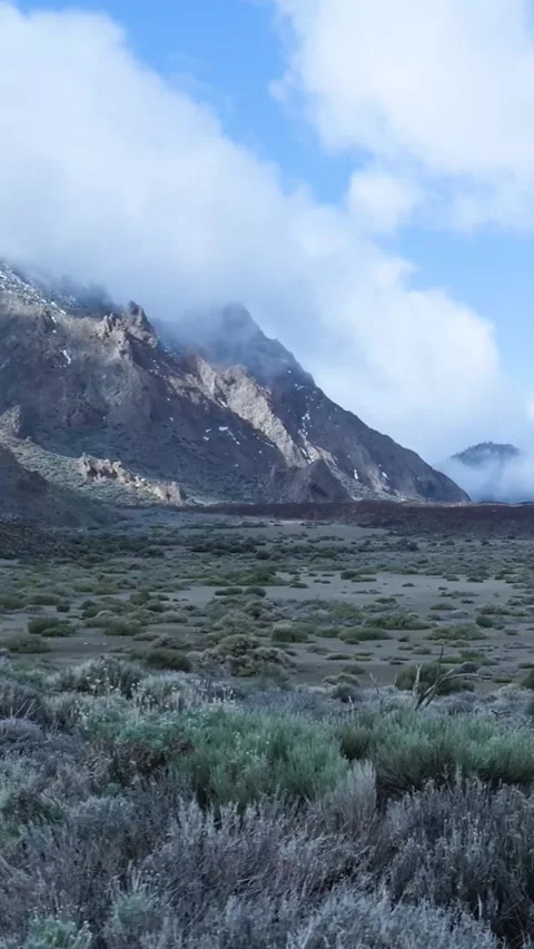 Volcanic landscape with mountains and clouds in teide national park Stockbeeldmateriaal 329864740