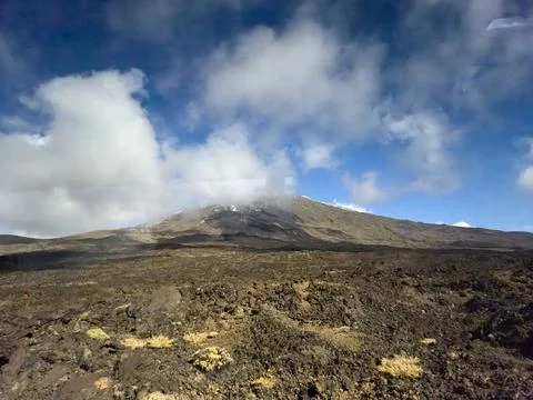 Volcanic Landscape Under Dramatic Cloudy Sky 스톡 사진