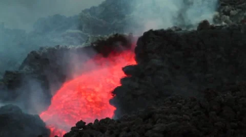Volcanic lava flow in channel at sunset Stock Footage 53302413