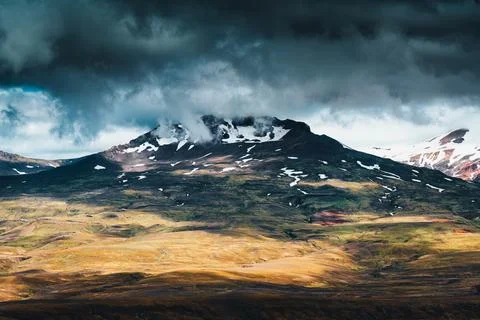 Volcanic mountain under stormy cloud on remote wilderness at Thorsmork, Ice.. Stock Photos