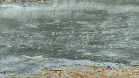Volcanic mud containing sulfur and geothermal steam from an active crater Stock Footage 320030555