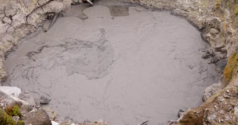 Volcanic pit with mud and boiling water with steam rising to the surface in.. Stock Footage 335028406