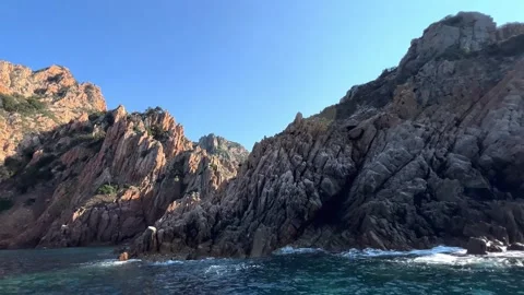 Volcanic rock formations of calanques de piana in corsica seen from boat Stock Footage 277521096