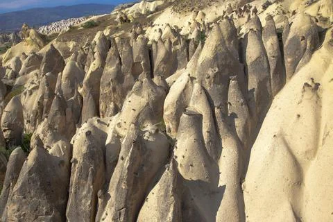 Volcanic rocks and limestone cliffs in Cappadocia valley. Turkey. Tourism and Stock Photos