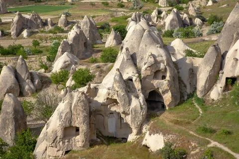 Volcanic rocks and limestone cliffs in Cappadocia valley. Turkey. Tourism and Stock Photos