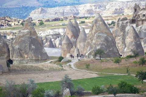 Volcanic rocks and limestone cliffs in Cappadocia valley. Turkey. Tourism and Stock Photos