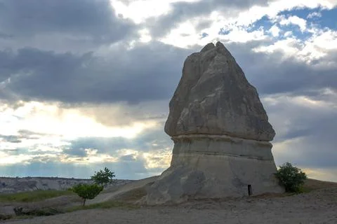 Volcanic rocks and limestone cliffs in Cappadocia valley. Turkey. Tourism and Stock Photos