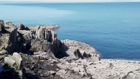 Volcanic rocks and ocean Stockbeeldmateriaal 155966262