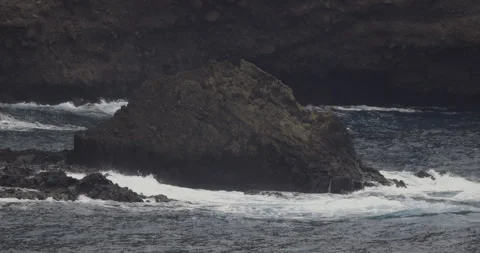 Volcanic rocks and ocean waves, 4K slomo Stock Footage 246332821