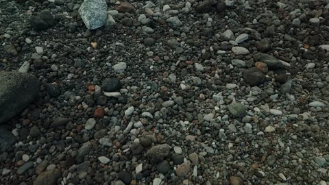 Volcanic Rocks and Pebbles Covering Beach Surface in Canary Islands, Spain 動画素材 346656111