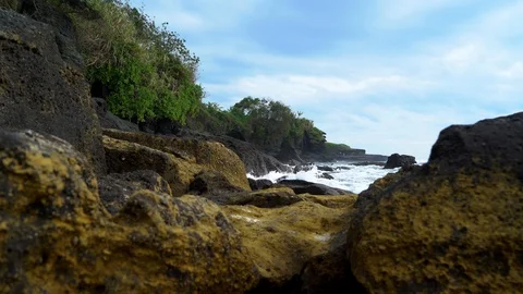 Volcanic rocks And The Waves Of Indian Ocean In Bali Indonesia 4k Stock Footage 104537814