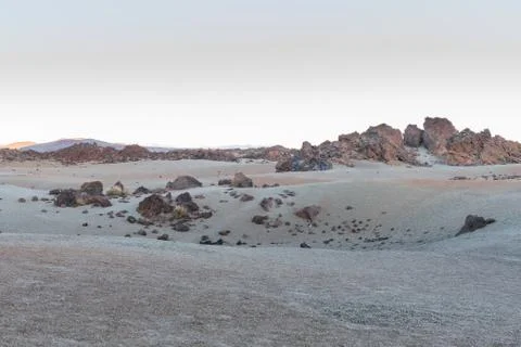 Volcanic sand of different colors, in a plain between mountain peaks at the t Stock Photos