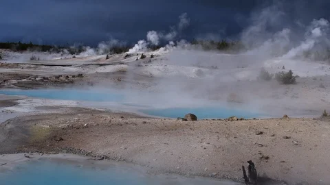 Volcanic steaming landscape while it rains Stock Footage 128206542
