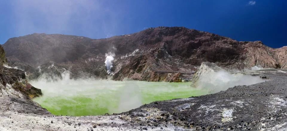 Volcanic Sulfur Crater Lake - inside the crater, colorful ground, white smoke Stock Photos