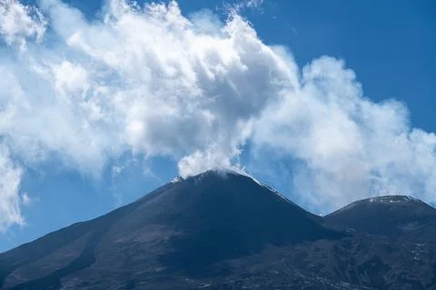 Volcanic summit with smoke cloud on Mount Etna Stock Photos