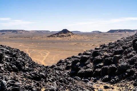 Volcanic Valley Framing Desert Plain in Giza, Egypt Stock Photos