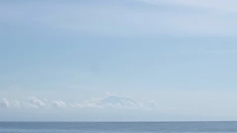 Volcano across the ocean Stock Footage 99210493