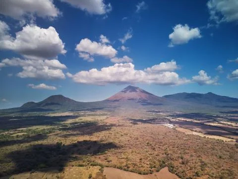 Volcano background on blue sky Stock Photos