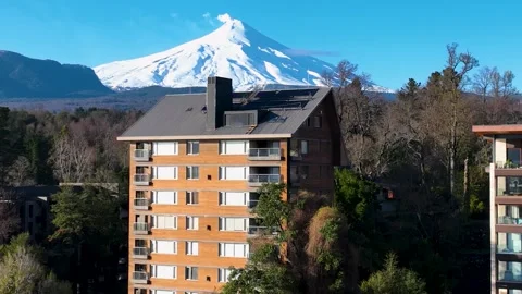 Volcano Behind Building At Pucon In Los Lagos Chile. Stock Footage 310000336