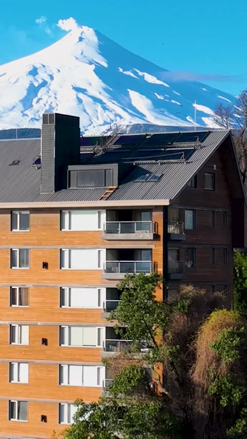 Volcano Behind Building At Pucon In Los Lagos Chile. Stock Footage 327537367