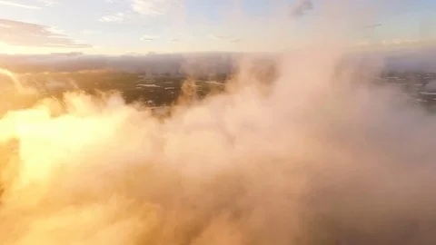 Volcano in the clouds. Flying in the clouds. Kamchatka on the sunset Stock Footage 72657170