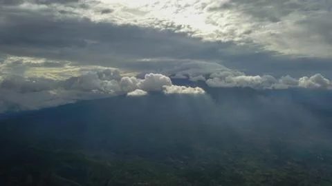 Volcano with cloudy clear sky. Mount Merapi in Indonesia. Cloudy sky with a v Stock-Fotos