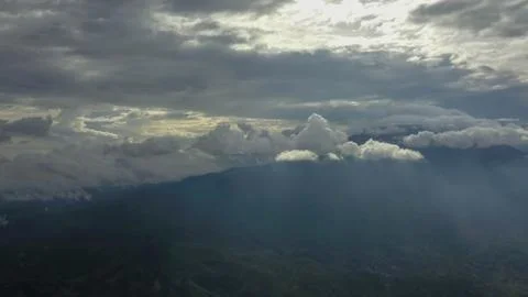 Volcano with cloudy clear sky. Mount Merapi in Indonesia. Cloudy sky with a v Stock Photos