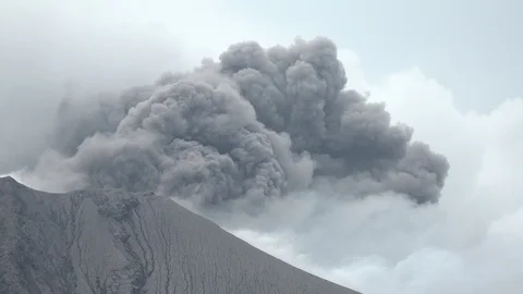 Volcano Crater Erupts Spewing Dark Ash Cloud Into Sky Video stock 87369727