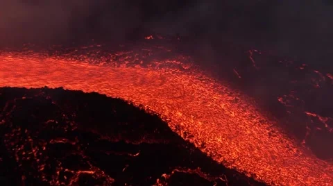 Volcano erupting with lava flow of night Stock Footage 49176349