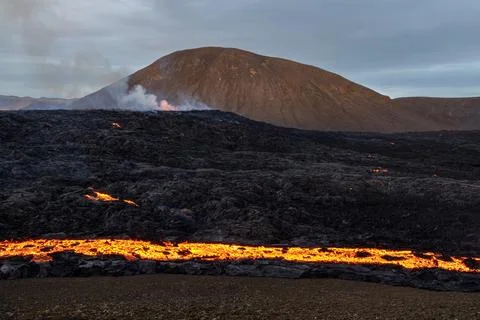 Volcano eruption and lava flow in Iceland Stock Photos