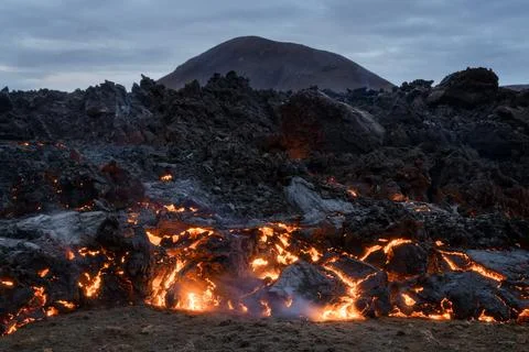 Volcano eruption and lava flow in Iceland Stock Photos