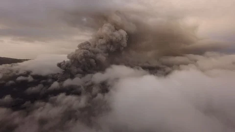 Volcano eruption at dawn, ashes break out of the volcano's vent Stock Footage 125482210