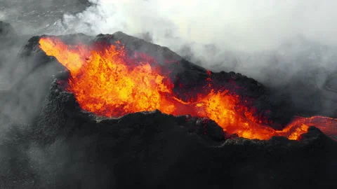 Volcano Eruption, Flowing Red Hot Lava Erupts from Crater, Incredible Natural Stock Footage 307731379