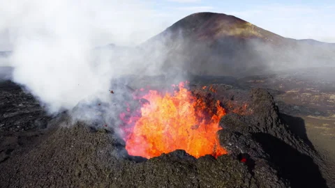 Volcano Eruption, Flowing Red Hot Lava Erupts from Crater, Iceland Stock Footage 320375072
