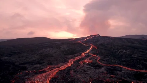 Volcano Eruption Lava Flow at Sunset. Drone Flies Low Along River of Lava Stock Footage 257101373