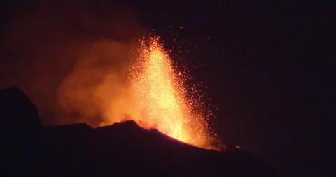 Volcano eruption the night after its bigger eruption Stock Footage 160368159