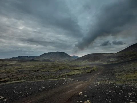 Volcano eruption site with a visible column of smoke. Stock Photos