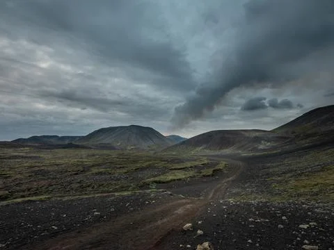 Volcano eruption site with a visible column of smoke. Stock Photos
